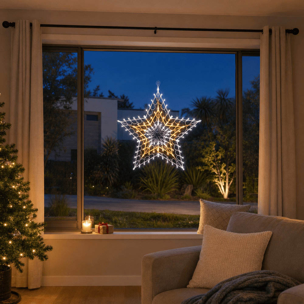 LED Retro Star Motif Warm White & Cool White glowing in a living room window at night