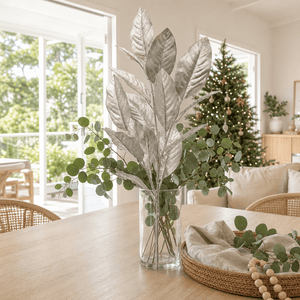 Silver Metallic Leaf Spray Stem arranged in a glass vase