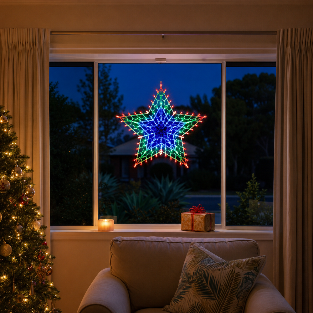 LED Retro Star Light RGB (50cm) glowing in a living room window at night