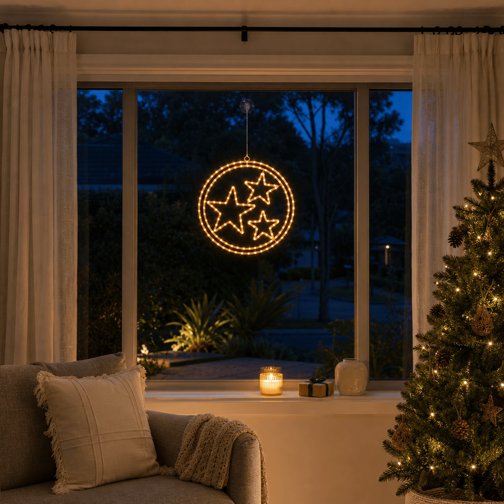 LED Double Rings Stars Twinkling Motif (52cm) glowing in a living room window at night