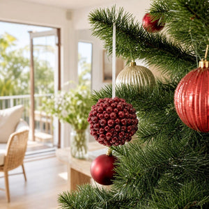 Red Berry Bauble on a decorated Christmas tree