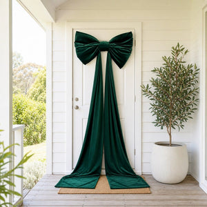 Giant Green Velvet Bow on a front door, styled in an Australian Christmas setting