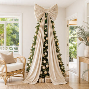 Giant Cream Velvet Bow on a decorated Christmas tree, its tails running the full 240cm to the floor