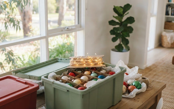 Christmas decorations packed properly in labelled lidded storage boxes and divided ornament storage in an Australian home