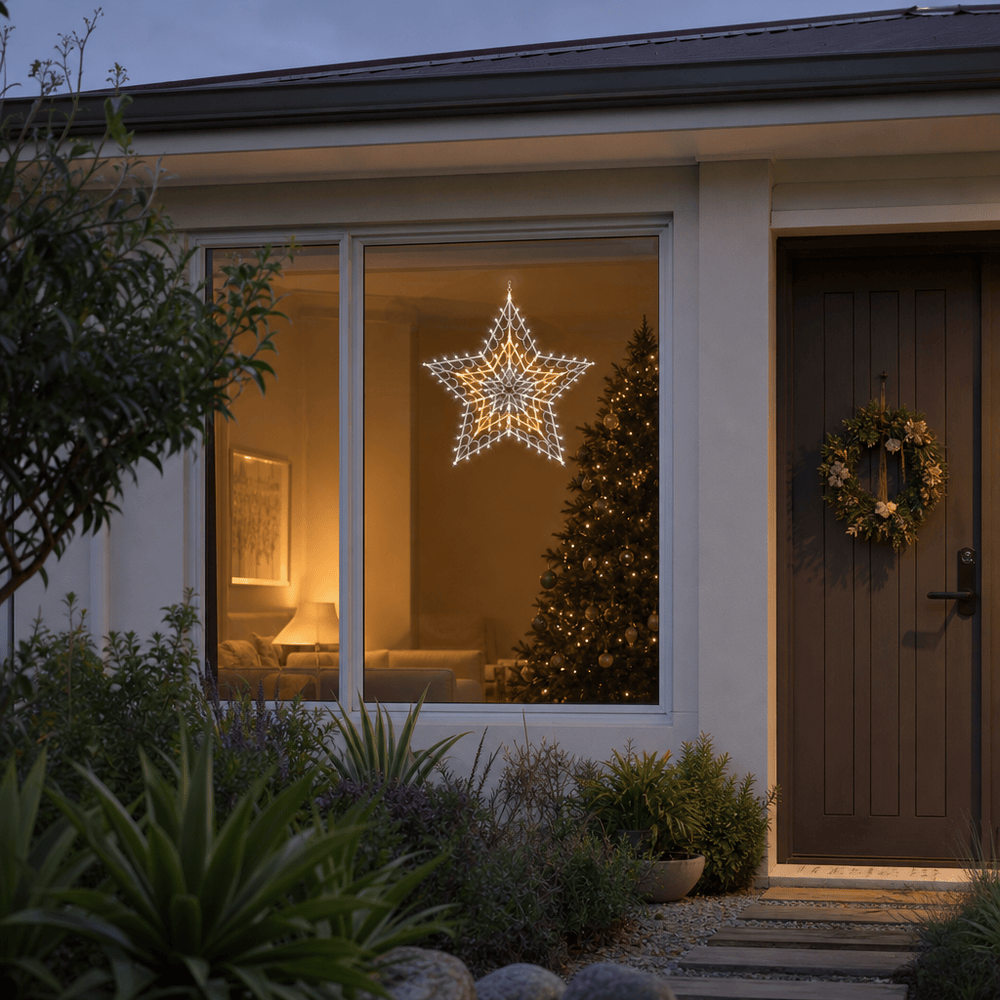 LED Retro Star Motif Warm White & Cool White hanging in a front window at night