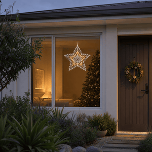 LED Retro Star Motif Warm White & Cool White hanging in a front window at night
