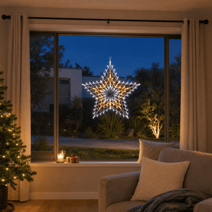 LED Retro Star Motif Warm White & Cool White glowing in a living room window at night