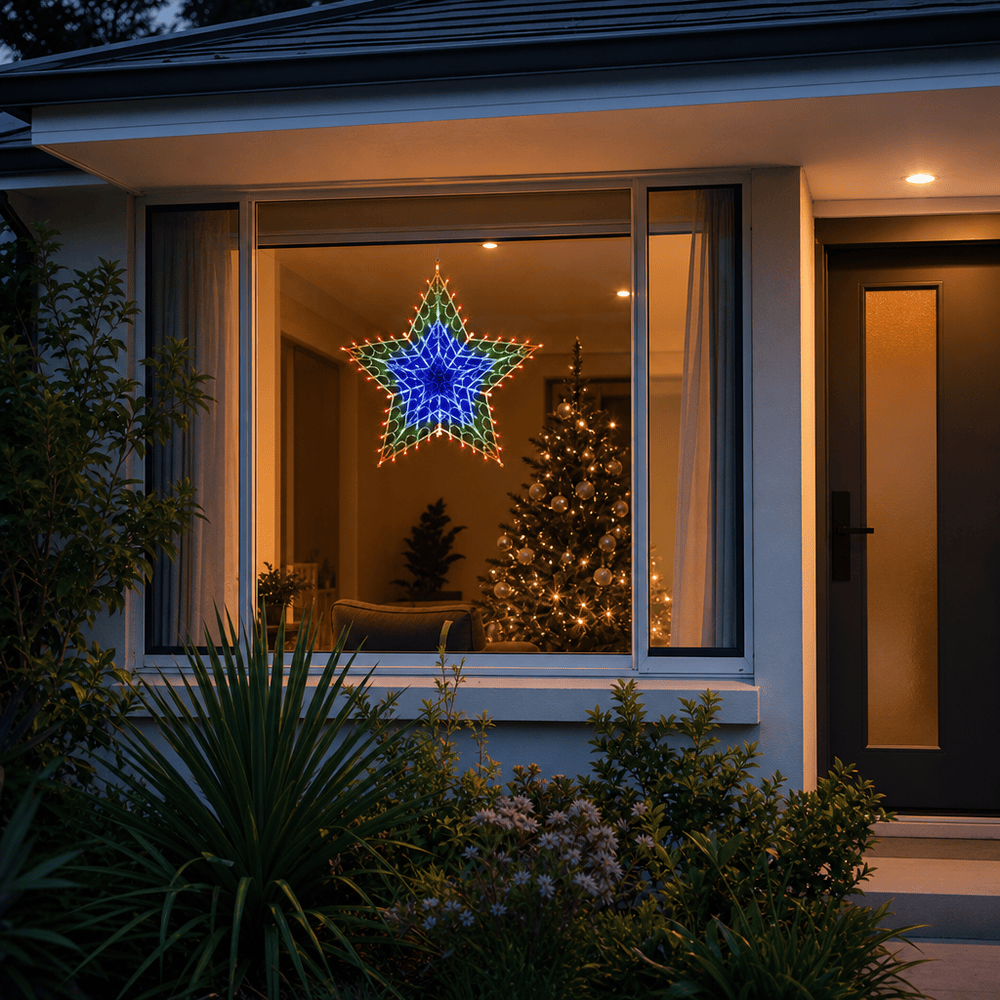 LED Retro Star Light RGB (50cm) hanging in a front window at night