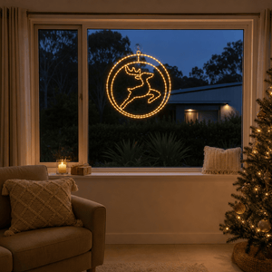 LED Double Rings Reindeer Twinkling Motif (52cm) glowing in a living room window at night