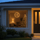 LED Double Rings Stars Twinkling Motif (52cm) hanging in a front window at night