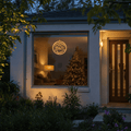 LED Christmas Time Pendant Light Motif (30cm) hanging in a front window at night