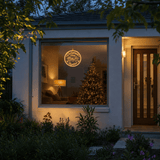 LED Christmas Time Pendant Light Motif (30cm) hanging in a front window at night