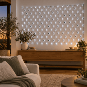 180 LED battery net light in cool white hung on a living room wall above a timber console