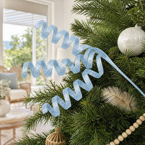 Pale Blue Glitter Swirl Stem (80cm) tucked into a decorated Christmas tree