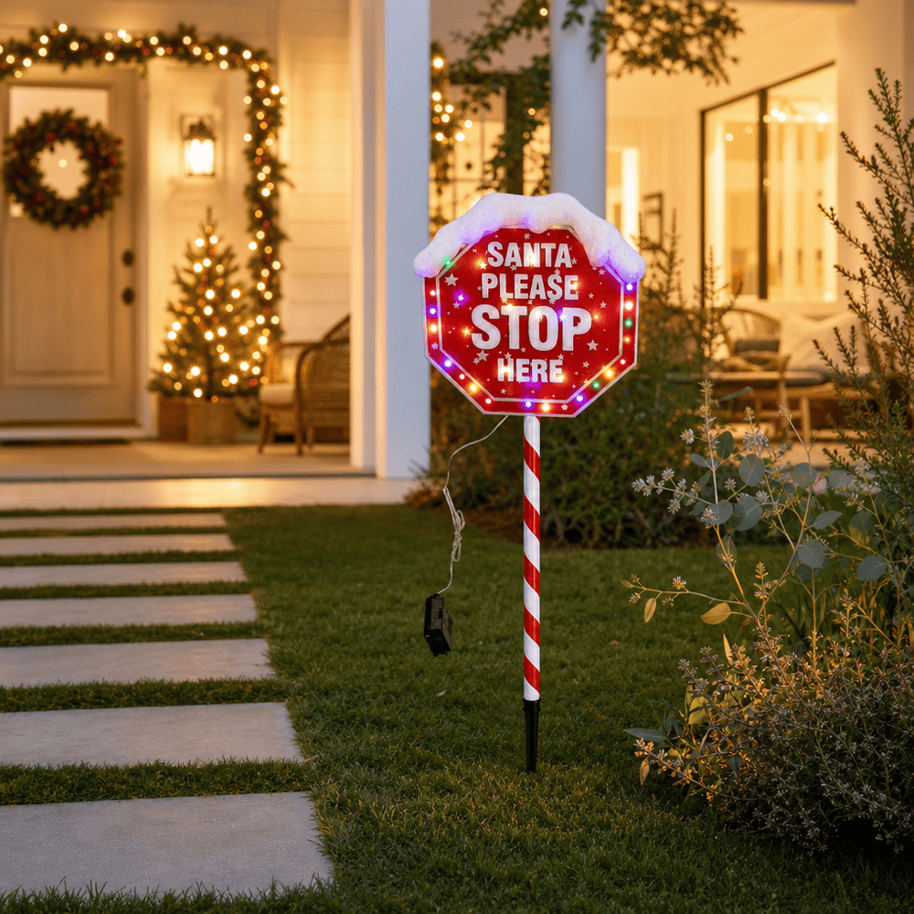 LED Battery Operated Santa Please Stop Here Stake lit up in an Australian Christmas setting