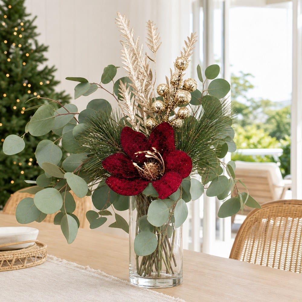 Metallic Pine and Bauble Magnolia Stem arranged in a glass vase