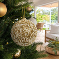 White Gold Beaded Bauble on a decorated Christmas tree