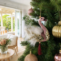 Dusty Rose Swan Ornament on a decorated Christmas tree