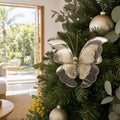 Golden 2-Toned Butterfly Clip on a decorated Christmas tree