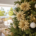 Gold Spiky Metallic Flower Stem on a decorated Christmas tree