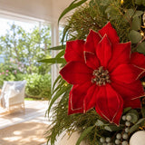 Deep Red Poinsettia Stem on a decorated Christmas tree