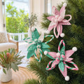 Poinsettia Plush Swirl Clip Asst styled in an Australian Christmas setting